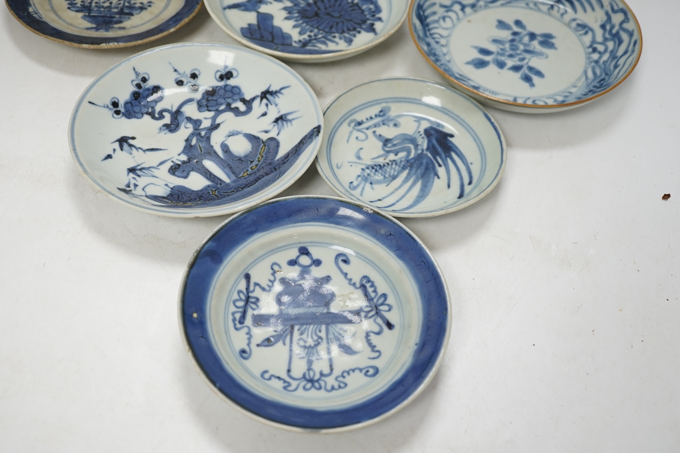 A group of 18th/19th century Chinese blue and white saucers and shallow dishes, largest 18cm in diameter. Condition - varies, mostly fair